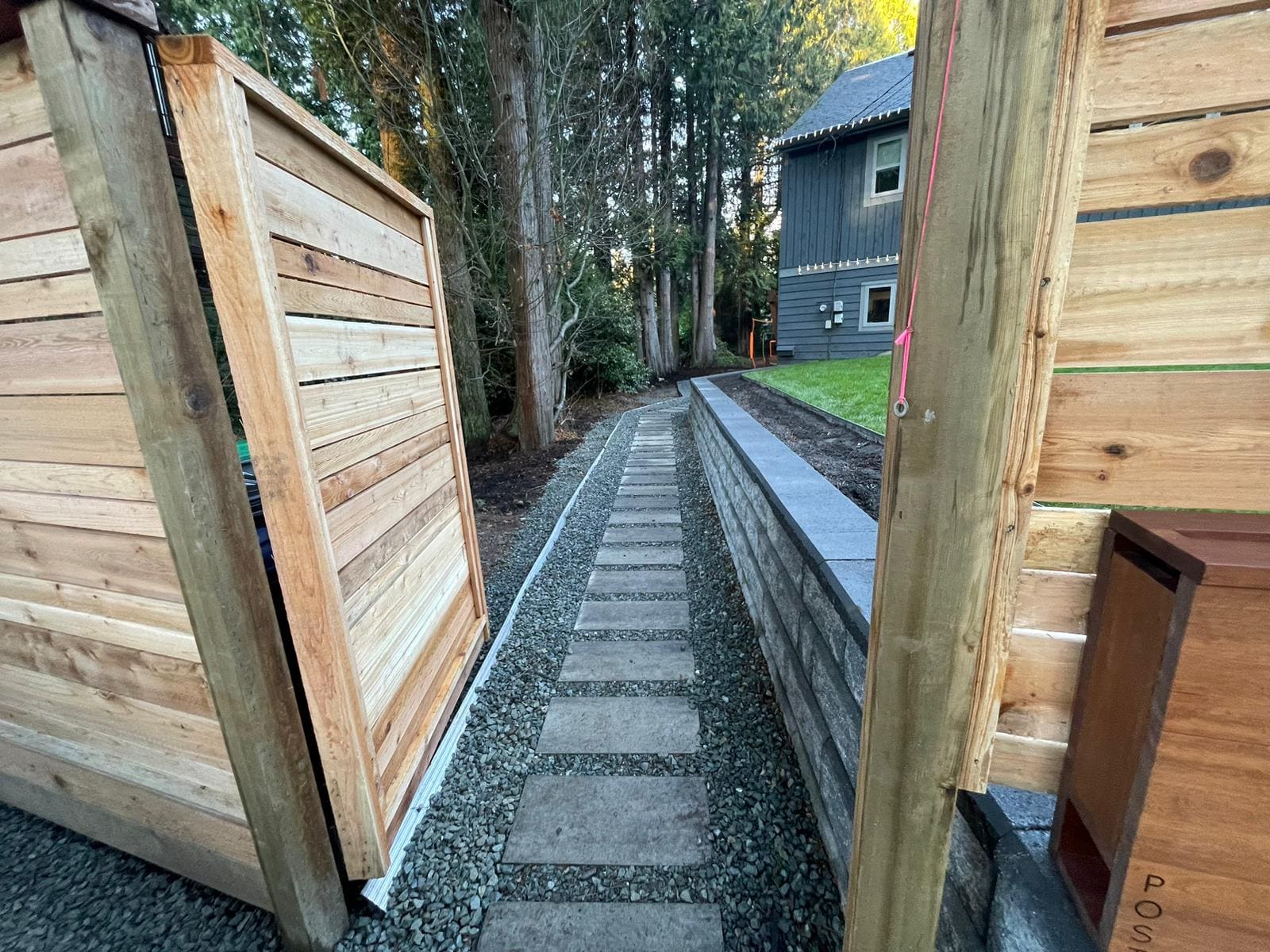 Allan Block Retaining Wall along a gravel stepping stone walkway