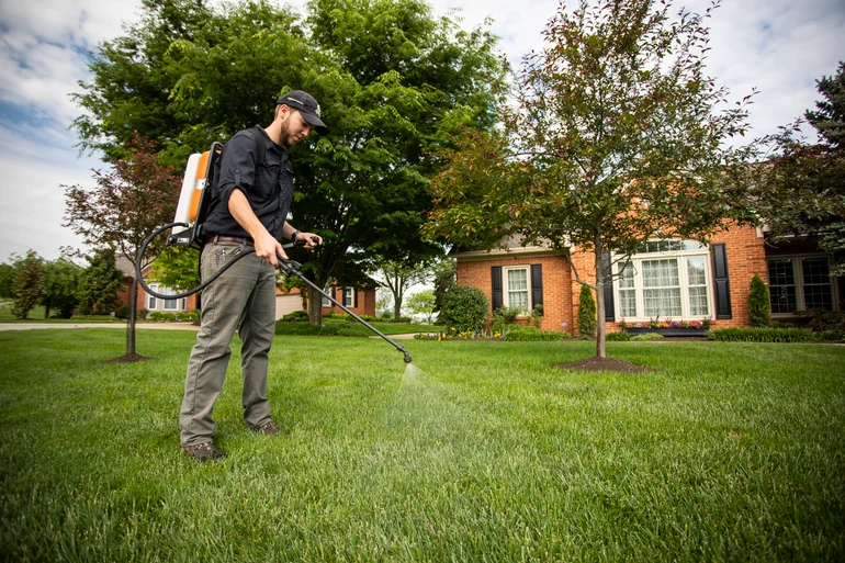 technician-spraying-lawn-1 spraying grub control